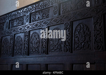 A wooden reredos in St. George`s Church, Clun, Shropshire, England, UK Stock Photo